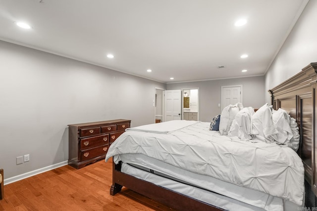 8 Cannon Ct, Little Rock, AR 72212 - bedroom featuring recessed lighting, light wood-type flooring, crown molding, ensuite bathroom, and baseboards
