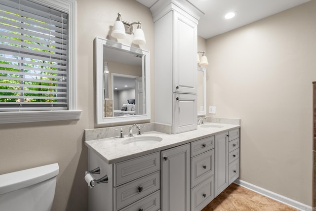 8 Cannon Ct, Little Rock, AR 72212 - full bathroom featuring toilet, plenty of natural light, double vanity, and tile patterned flooring