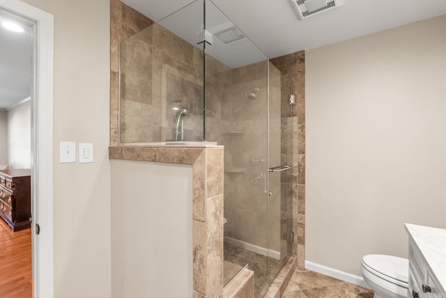 8 Cannon Ct, Little Rock, AR 72212 - bathroom featuring toilet, a shower stall, baseboards, and vanity