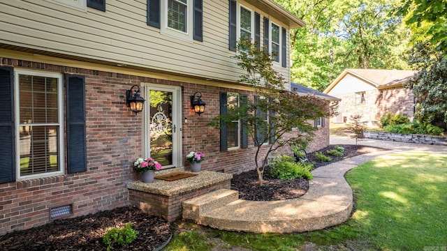 8 Cannon Ct, Little Rock, AR 72212 - entrance to property featuring brick siding and a lawn