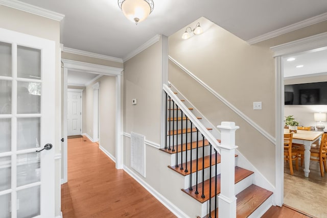8 Cannon Ct, Little Rock, AR 72212 - stairway with wood finished floors, ornamental molding, and baseboards