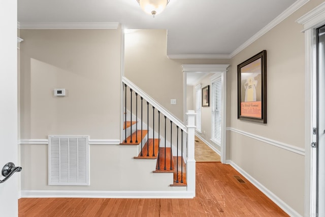 8 Cannon Ct, Little Rock, AR 72212 - stairs with wood finished floors, crown molding, and baseboards