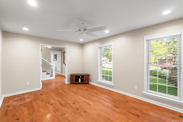 8 Cannon Ct, Little Rock, AR 72212 - unfurnished living room featuring light wood finished floors, baseboards, stairs, a ceiling fan, and recessed lighting