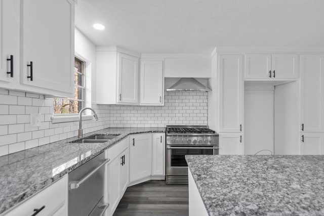 716 Vinson, Little Rock, AR 72205 - kitchen with stainless steel appliances, a sink, light stone countertops, white cabinets, and recessed lighting