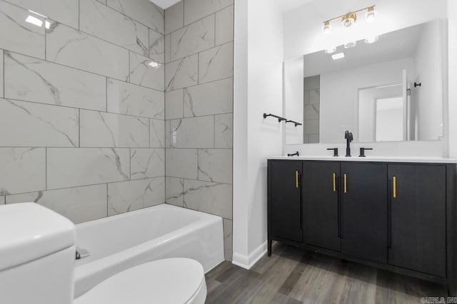 716 Vinson, Little Rock, AR 72205 - full bathroom featuring toilet, wood finished floors, baseboards, vanity, and shower / bath combination