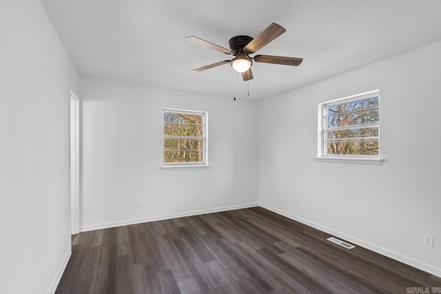 716 Vinson, Little Rock, AR 72205 - empty room with dark wood-style flooring, ceiling fan, baseboards, and a textured ceiling