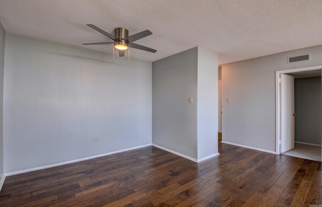 700 E 9th St Unit 9A, Little Rock, AR 72202 - unfurnished room with dark wood-style floors, a ceiling fan, a textured ceiling, and baseboards