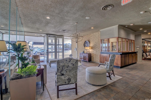 700 E 9th St Unit 9A, Little Rock, AR 72202 - lobby featuring floor to ceiling windows and a textured ceiling