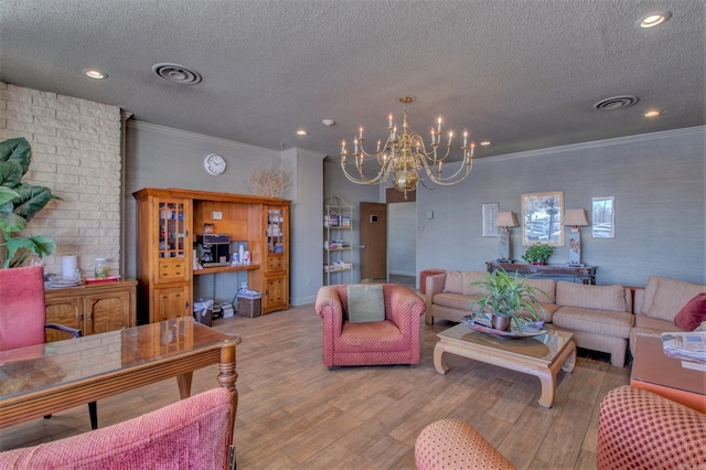 700 E 9th St Unit 9A, Little Rock, AR 72202 - living room with a textured ceiling, a chandelier, light wood finished floors, crown molding, and recessed lighting