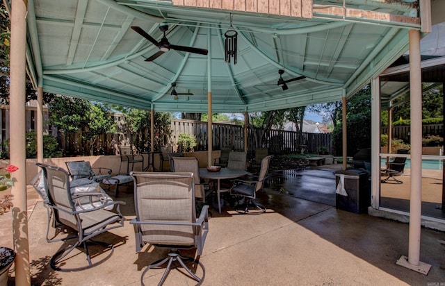 700 E 9th St Unit 9A, Little Rock, AR 72202 - view of patio / terrace with a gazebo, a fenced backyard, outdoor dining space, and a ceiling fan