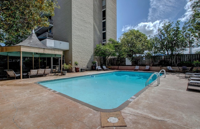 700 E 9th St Unit 9A, Little Rock, AR 72202 - view of swimming pool with a patio, a fenced backyard, and an outdoor living space