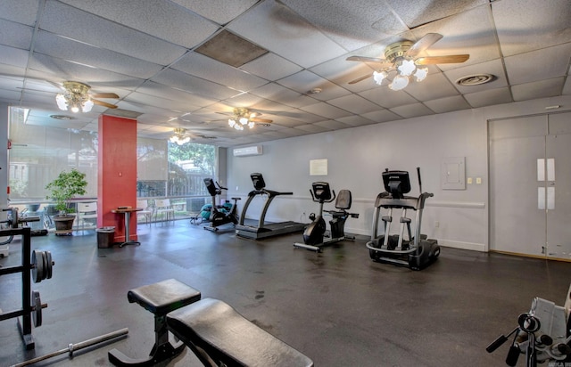 700 E 9th St Unit 9A, Little Rock, AR 72202 - workout area featuring a ceiling fan, an AC wall unit, a drop ceiling, and baseboards