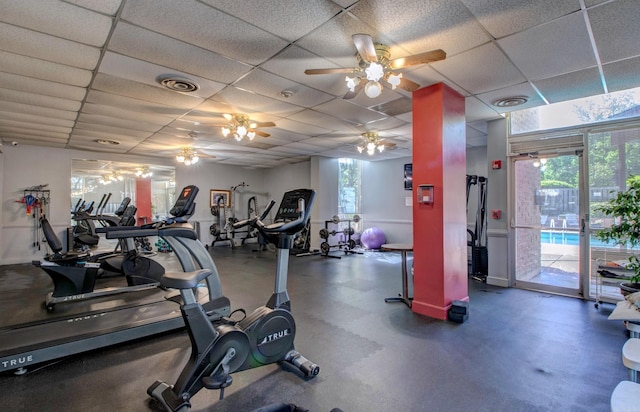 700 E 9th St Unit 9A, Little Rock, AR 72202 - exercise room with a paneled ceiling, a ceiling fan, and healthy amount of natural light