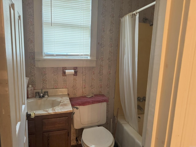 bathroom with wallpapered walls, vanity, toilet, and shower / bath combo