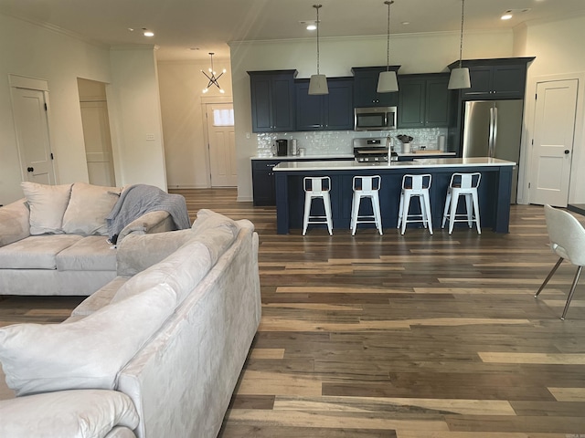 2009 Berkshire Dr, Benton, AR 72019 - living room with dark wood-style flooring, crown molding, and recessed lighting