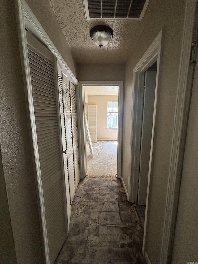 2015 Singleton Ct, Little Rock, AR 72204 - corridor featuring a textured ceiling