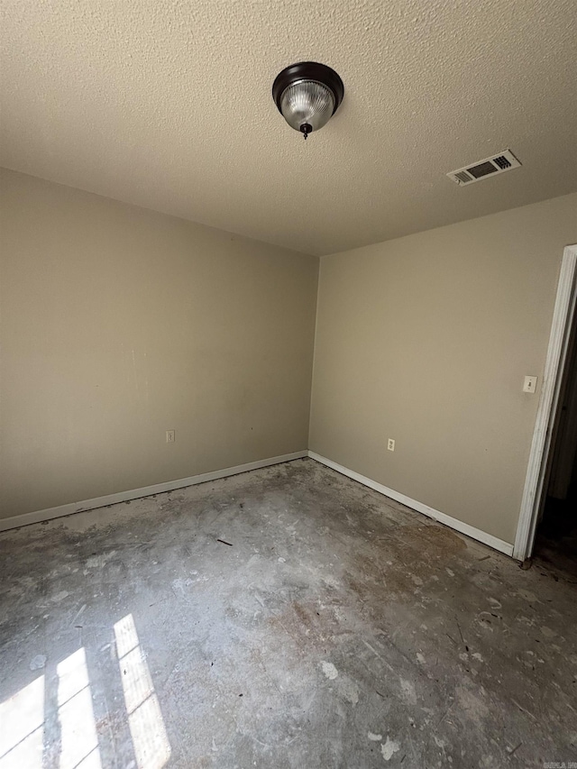 2015 Singleton Ct, Little Rock, AR 72204 - empty room featuring concrete flooring, a textured ceiling, and baseboards