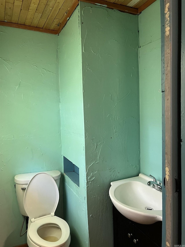 600 King St, Searcy, AR 72143 - half bathroom with wood ceiling, toilet, vanity, and lofted ceiling