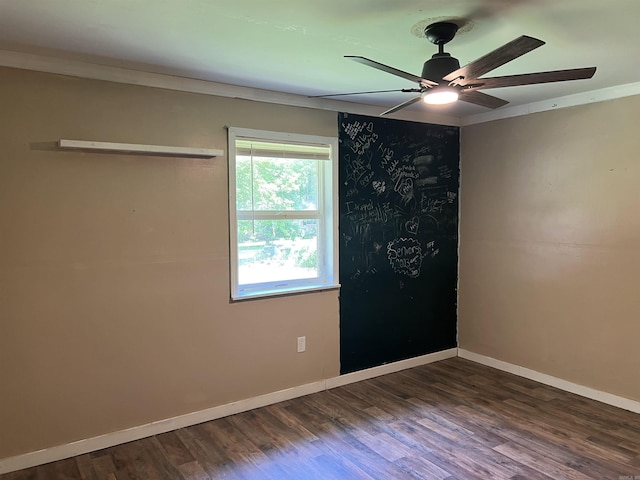600 King St, Searcy, AR 72143 - unfurnished room featuring ceiling fan, dark wood-style floors, baseboards, and ornamental molding