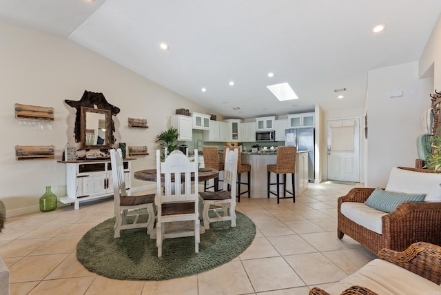 110 Jamison Ln, Hot Springs, AR 71913 - dining space featuring a skylight, lofted ceiling, light tile patterned flooring, and recessed lighting