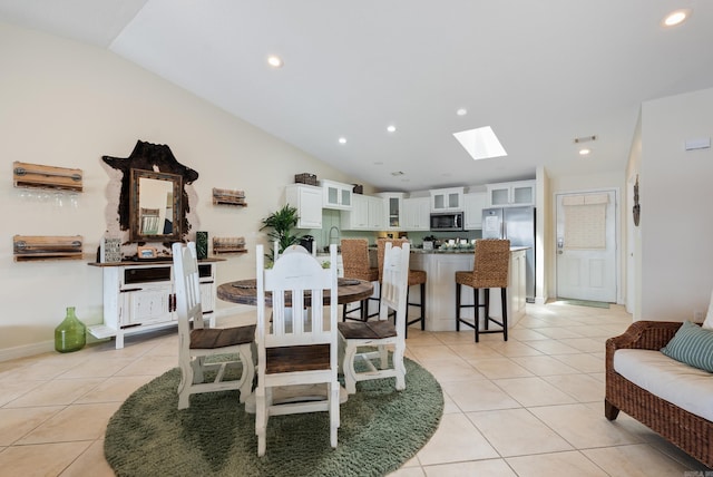 110 Jamison Ln, Hot Springs, AR 71913 - dining room featuring vaulted ceiling, a skylight, light tile patterned floors, and recessed lighting