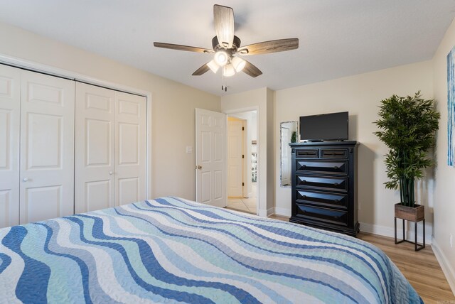 110 Jamison Ln, Hot Springs, AR 71913 - bedroom featuring light wood-type flooring, a closet, baseboards, and ceiling fan