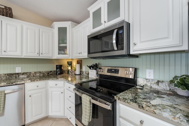 110 Jamison Ln, Hot Springs, AR 71913 - kitchen featuring appliances with stainless steel finishes, white cabinetry, and dark stone counters