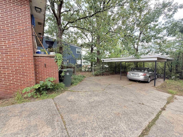 215217 N Pierce St, Little Rock, AR 72205 - view of parking / parking lot with asphalt driveway and a carport
