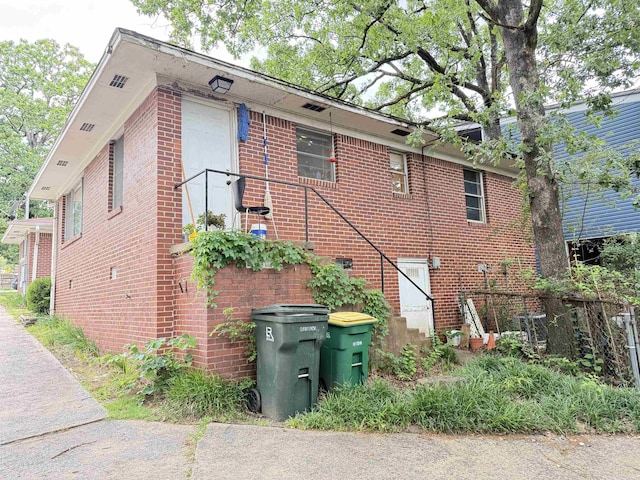 215217 N Pierce St, Little Rock, AR 72205 - view of property exterior with brick siding and fence