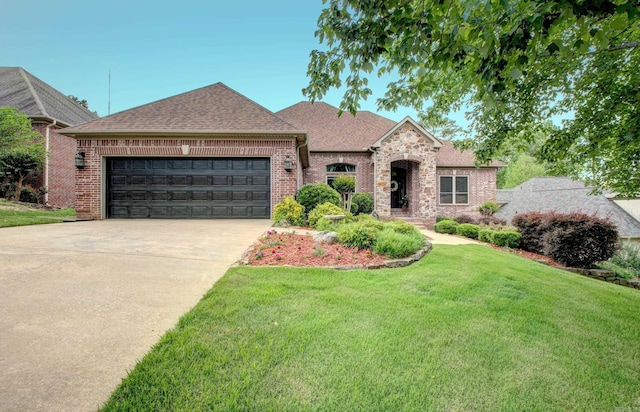 32 Bronte Ct, Little Rock, AR 72223 - french country home with an attached garage, a front yard, concrete driveway, roof with shingles, and brick siding