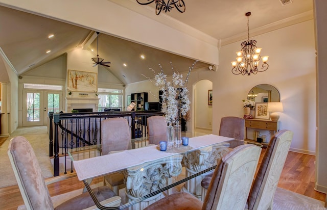 32 Bronte Ct, Little Rock, AR 72223 - dining room featuring arched walkways, a fireplace, a chandelier, ceiling fan, and ornamental molding