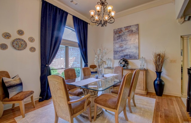 32 Bronte Ct, Little Rock, AR 72223 - dining area featuring a chandelier, light wood-type flooring, baseboards, and ornamental molding