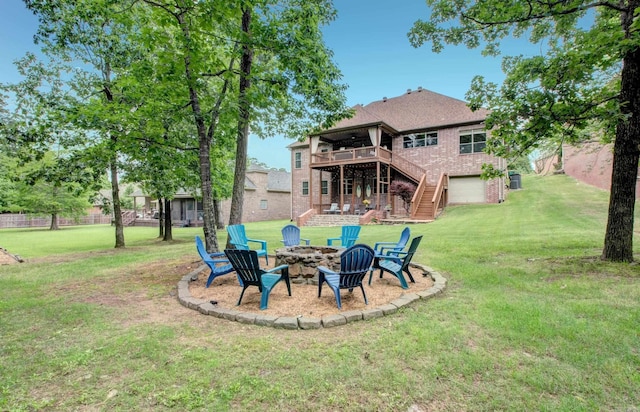 32 Bronte Ct, Little Rock, AR 72223 - back of house featuring a fire pit, stairs, a deck, brick siding, and a yard