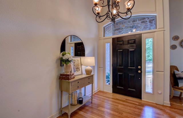 32 Bronte Ct, Little Rock, AR 72223 - entrance foyer featuring a chandelier, wood finished floors, and baseboards