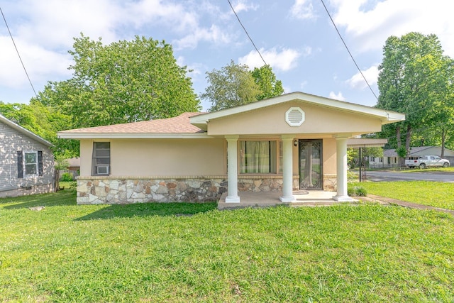 2616 Stallings Ln, Jonesboro, AR 72401 - view of front of house featuring stone siding, stucco siding, and a front lawn