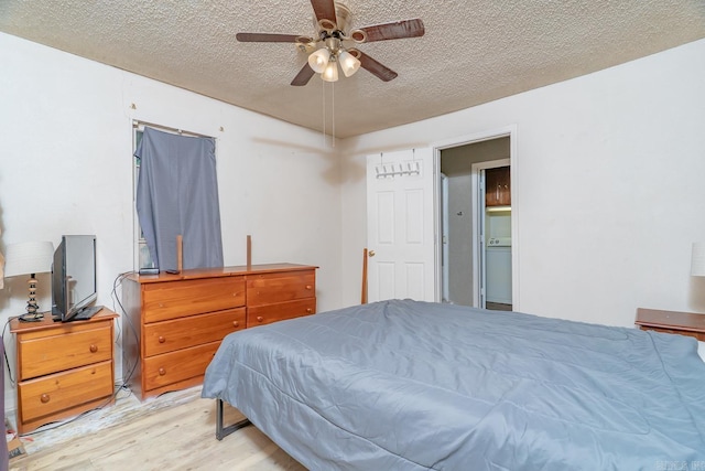 2616 Stallings Ln, Jonesboro, AR 72401 - bedroom featuring light wood-style flooring, a textured ceiling, and ceiling fan
