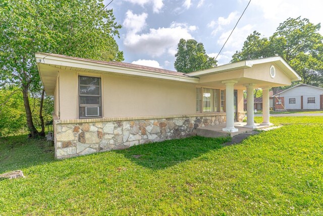 2616 Stallings Ln, Jonesboro, AR 72401 - view of front of property featuring stone siding, a front yard, and stucco siding