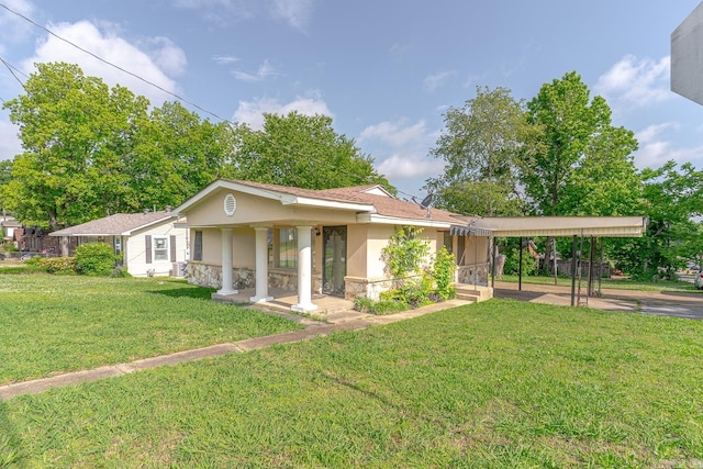 2616 Stallings Ln, Jonesboro, AR 72401 - ranch-style home with stucco siding, a front lawn, and an attached carport