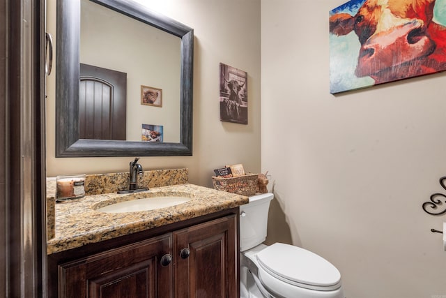 half bath with vanity and toilet