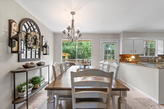 3311 Hazy Ridge Ct, Little Rock, AR 72227 - dining room featuring a chandelier and ornamental molding
