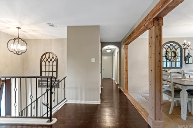 3311 Hazy Ridge Ct, Little Rock, AR 72227 - corridor with a chandelier, arched walkways, hardwood / wood-style floors, an upstairs landing, and baseboards