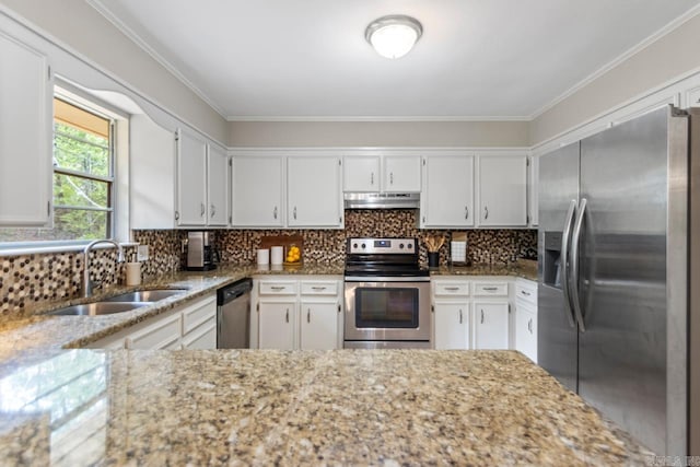 3311 Hazy Ridge Ct, Little Rock, AR 72227 - kitchen featuring appliances with stainless steel finishes, under cabinet range hood, a sink, light stone countertops, and crown molding