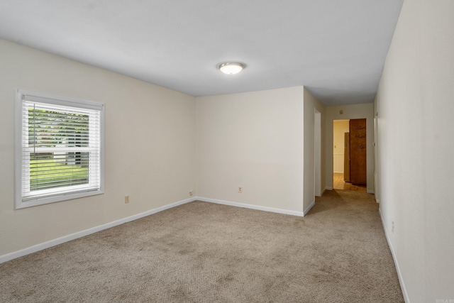 503 N Walnut St, Searcy, AR 72143 - carpeted empty room featuring baseboards