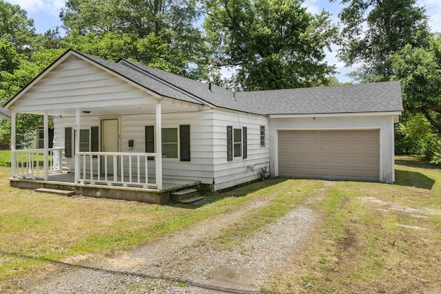 503 N Walnut St, Searcy, AR 72143 - view of front of home with driveway, a porch, a shingled roof, and a garage