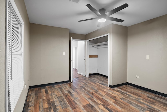 503 N Walnut St, Searcy, AR 72143 - unfurnished bedroom featuring dark wood-style flooring, baseboards, ceiling fan, and a closet