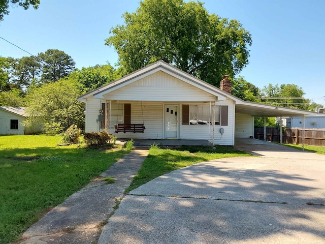 3810 Congo Rd, Benton, AR 72019 - bungalow-style house with driveway, covered porch, a chimney, and an attached carport