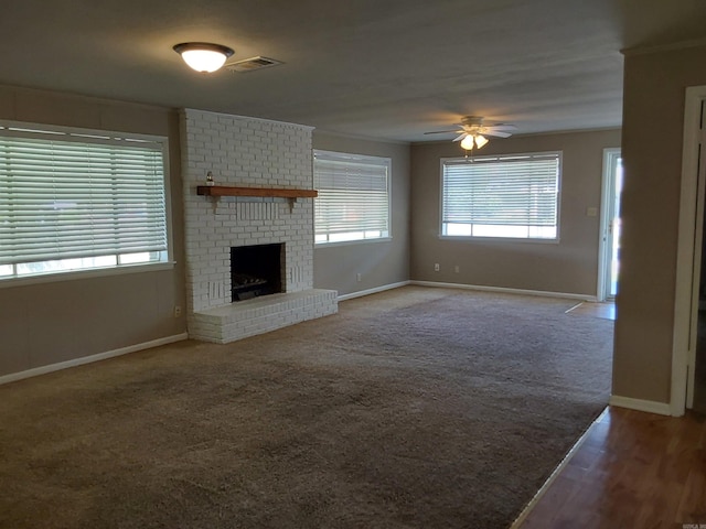 3810 Congo Rd, Benton, AR 72019 - unfurnished living room with ceiling fan, baseboards, a brick fireplace, ornamental molding, and carpet flooring