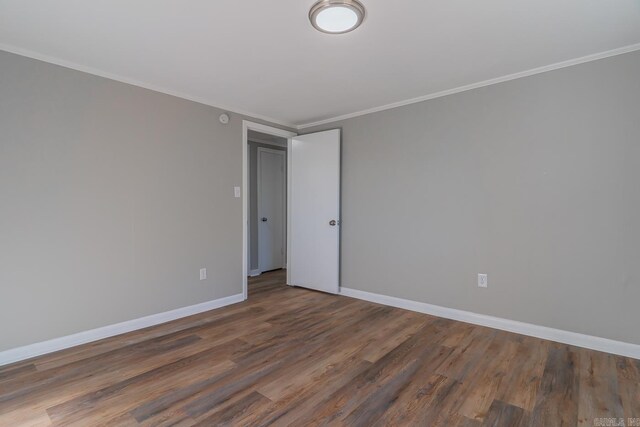 3907 Gamblin Dr, Jonesboro, AR 72404 - unfurnished room featuring wood finished floors, crown molding, and baseboards