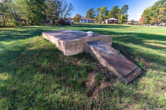 3907 Gamblin Dr, Jonesboro, AR 72404 - entry to storm shelter with a yard
