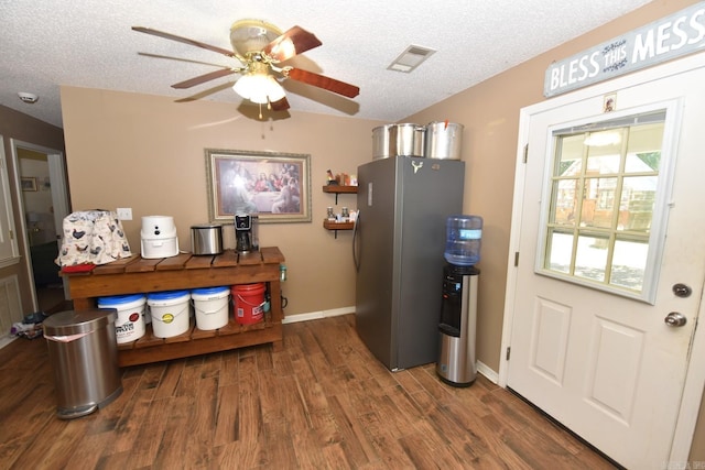 22 Primrose Ln, Greenbrier, AR 72058 - kitchen featuring freestanding refrigerator, wood finished floors, ceiling fan, a textured ceiling, and baseboards